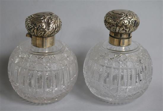 A pair of late Victorian silver mounted cut glass globular scent bottles, Haseler Brothers, Birmingham, 1895/6, 14.8cm.